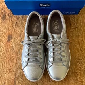 Keds metallic silver sneakers.